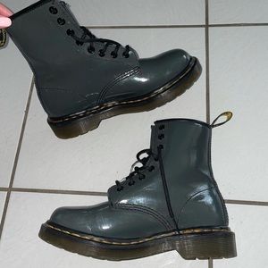 Dr.Martens, they are in great condition! They are a greyish blue color.
